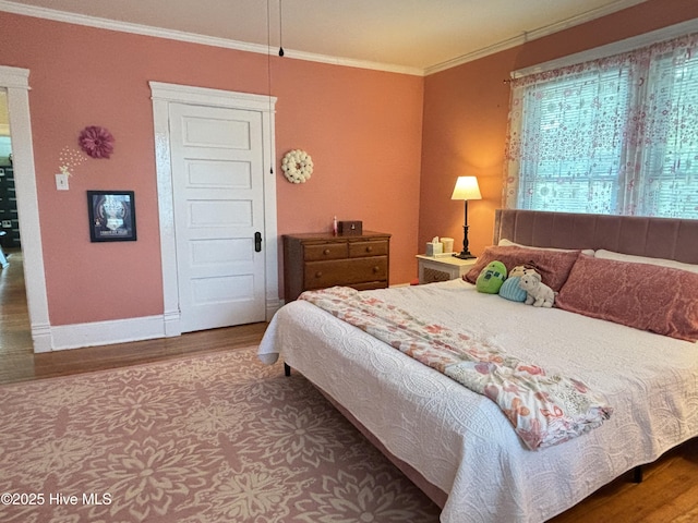 124 W Main St, Woodland, NC 27897 - bedroom with wood finished floors and crown molding