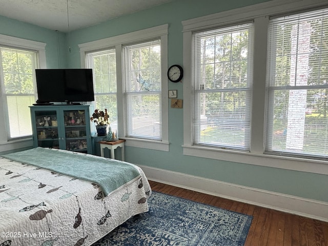 124 W Main St, Woodland, NC 27897 - bedroom featuring multiple windows and wood finished floors
