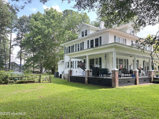 124 W Main St, Woodland, NC 27897 - back of house with a yard, a chimney, a porch, and crawl space