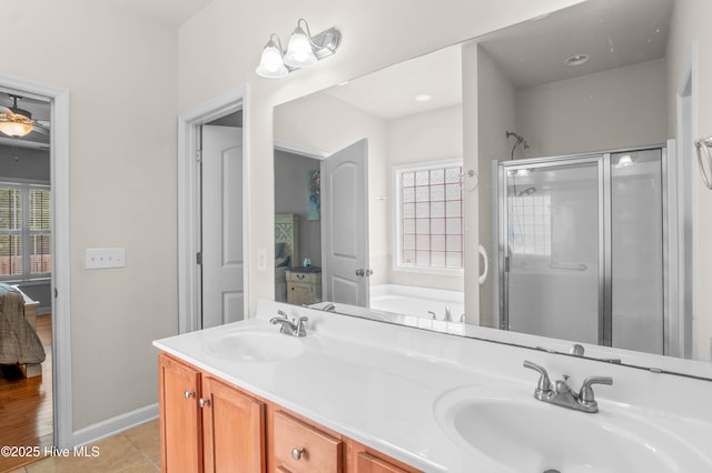 213 Wynbrookee Ln, Jacksonville, NC 28546 - full bathroom featuring a shower stall, double vanity, a garden tub, ensuite bathroom, and tile patterned floors