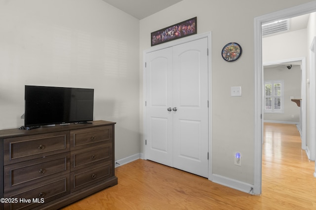 213 Wynbrookee Ln, Jacksonville, NC 28546 - bedroom with light wood-type flooring and a closet