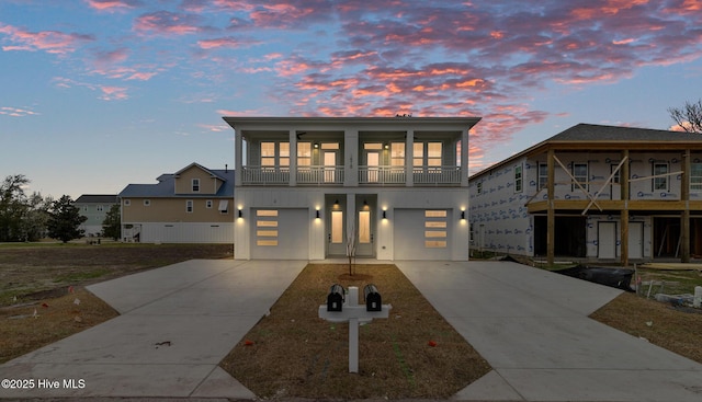 1518 Pinfish Ln Unit 2, Carolina Beach, NC 28428 - view of front of property with a balcony, driveway, and a garage