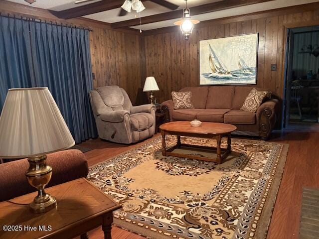 2904 Jason Dr, Rocky Mount, NC 27803 - living area featuring beamed ceiling, wooden walls, wood finished floors, and ceiling fan