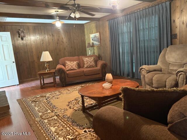 2904 Jason Dr, Rocky Mount, NC 27803 - living area featuring a ceiling fan, wood walls, wood finished floors, and beam ceiling