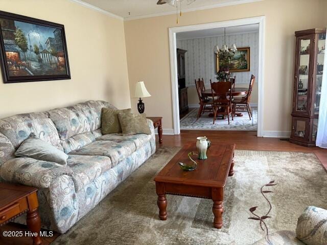 2904 Jason Dr, Rocky Mount, NC 27803 - living room with ornamental molding, wood finished floors, a ceiling fan, and a chandelier