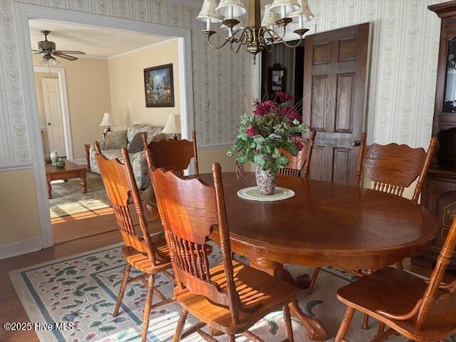 2904 Jason Dr, Rocky Mount, NC 27803 - dining room featuring wallpapered walls, a chandelier, ceiling fan, and wood finished floors