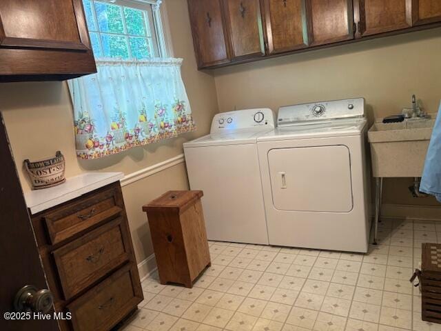 2904 Jason Dr, Rocky Mount, NC 27803 - laundry room featuring cabinet space, washer and clothes dryer, and light flooring