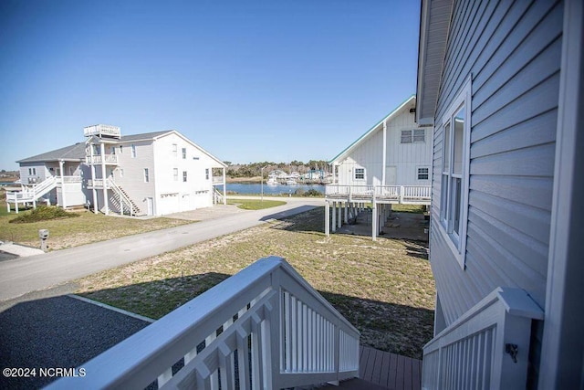 130 Crab St, Holden Beach, NC 28462 - view of yard with a water view and stairs