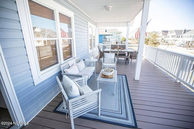 130 Crab St, Holden Beach, NC 28462 - deck featuring an outdoor hangout area