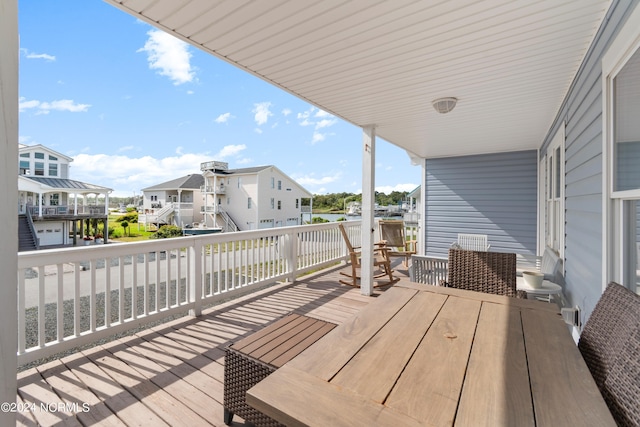130 Crab St, Holden Beach, NC 28462 - wooden terrace with a residential view