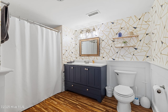 215 S Water St Apt 206, Wilmington, NC 28401 - full bath featuring wallpapered walls, wood finished floors, vanity, and curtained shower