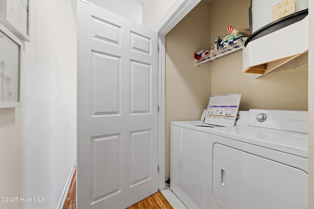 215 S Water St Apt 206, Wilmington, NC 28401 - laundry room with independent washer and dryer and light wood-style flooring
