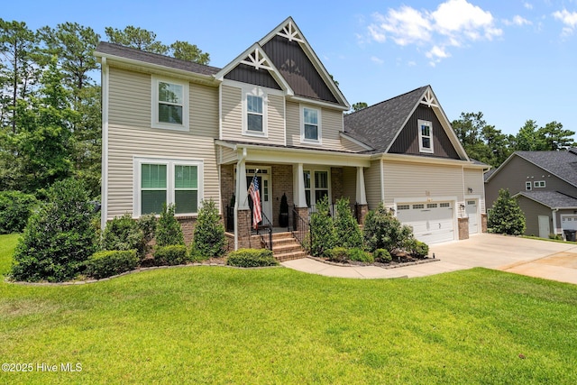 332 Mountain Run, West End, NC 27376 - craftsman-style home with brick siding, concrete driveway, a front lawn, and a garage