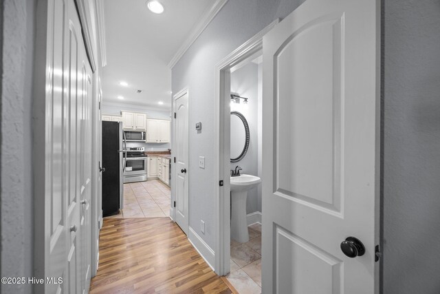 2324 Dovedale Dr Unit B, Greenville, NC 27834 - hall featuring crown molding, recessed lighting, and light wood finished floors