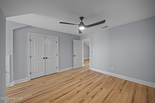 2324 Dovedale Dr Unit B, Greenville, NC 27834 - unfurnished bedroom with wood finished floors, a closet, and a ceiling fan