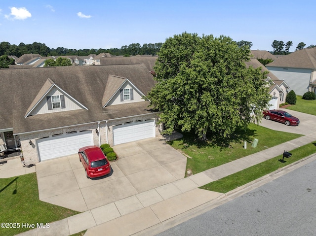 2324 Dovedale Dr Unit B, Greenville, NC 27834 - view of front of home with driveway, brick siding, roof with shingles, and a garage