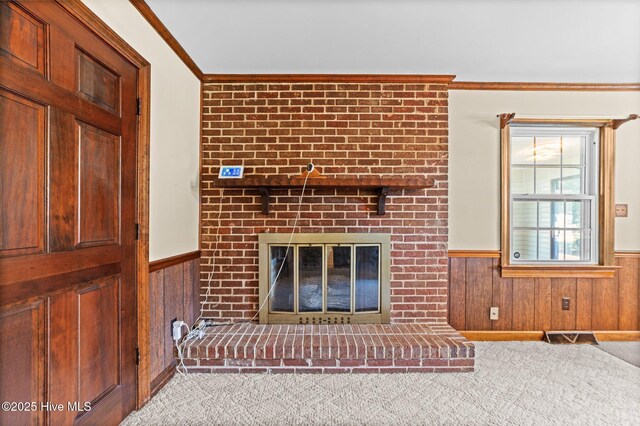 6715 Clarks Neck Rd, Washington, NC 27889 - unfurnished living room featuring a wainscoted wall, a fireplace, carpet floors, ornamental molding, and wood walls