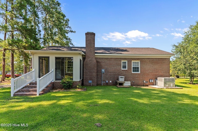 6715 Clarks Neck Rd, Washington, NC 27889 - back of house featuring a chimney, a yard, crawl space, and brick siding