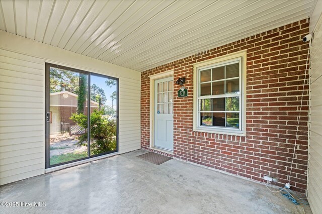 6715 Clarks Neck Rd, Washington, NC 27889 - doorway to property with brick siding and a surveillance system