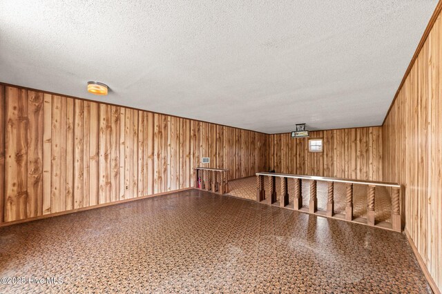6715 Clarks Neck Rd, Washington, NC 27889 - bonus room with a textured ceiling and wood walls