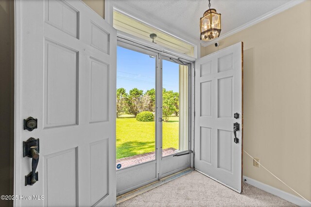 6715 Clarks Neck Rd, Washington, NC 27889 - entrance foyer featuring plenty of natural light, light carpet, crown molding, and a chandelier