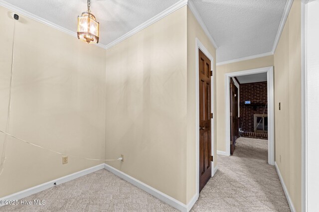 6715 Clarks Neck Rd, Washington, NC 27889 - hall featuring light carpet, a chandelier, a textured ceiling, and crown molding