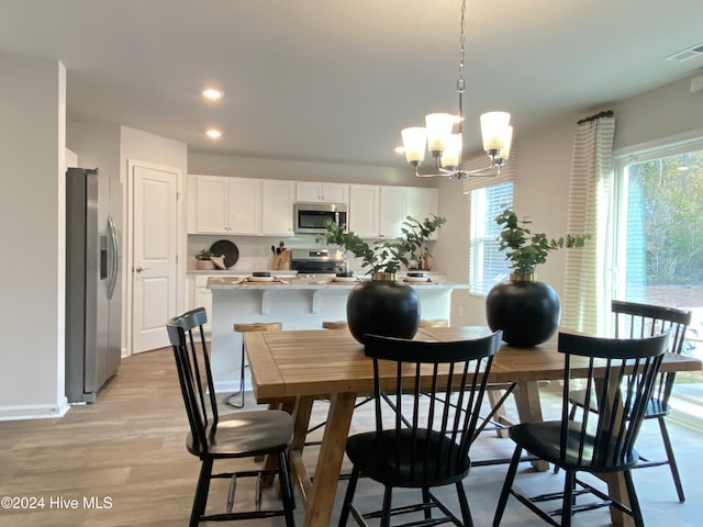 5191 Meagan Ln NE, Winnabow, NC 28479 - dining area with a chandelier, light wood finished floors, and recessed lighting