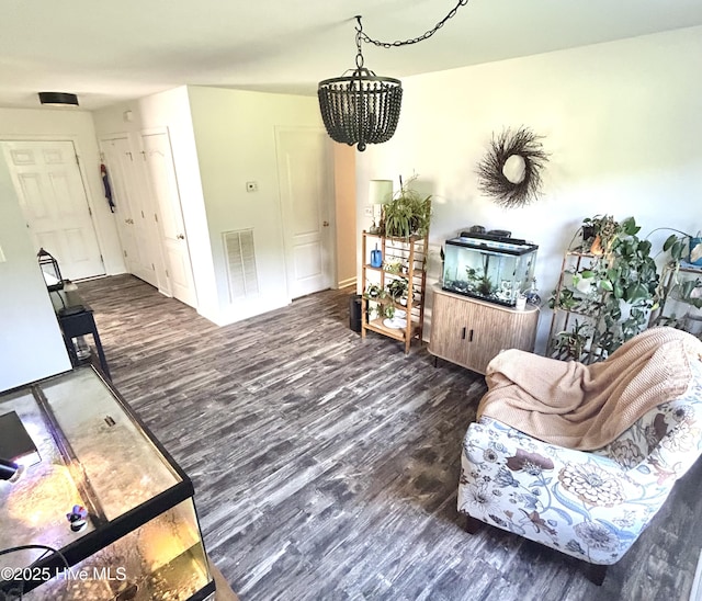 106 Cotton Ct, Camden, NC 27921 - living room featuring wood finished floors and a chandelier