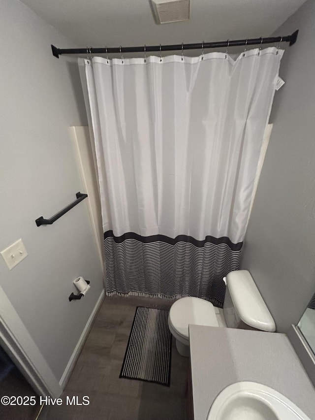 106 Cotton Ct, Camden, NC 27921 - full bathroom featuring vanity, wood finished floors, and curtained shower