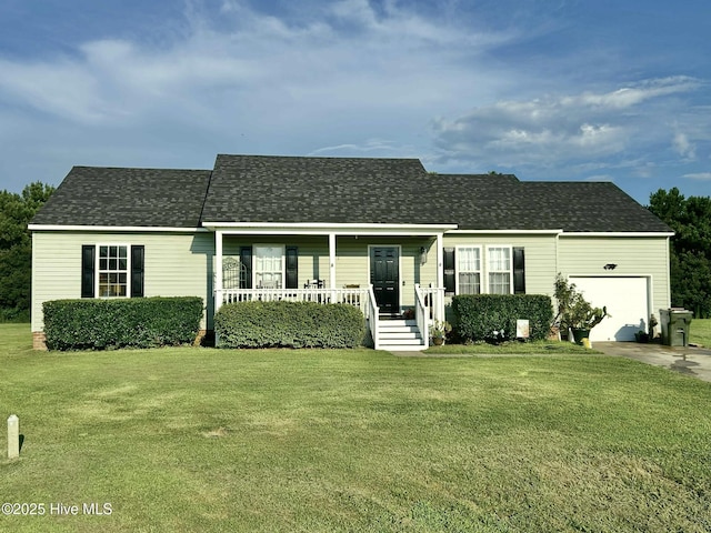 106 Cotton Ct, Camden, NC 27921 - view of front of house with an attached garage, covered porch, a front lawn, and roof with shingles