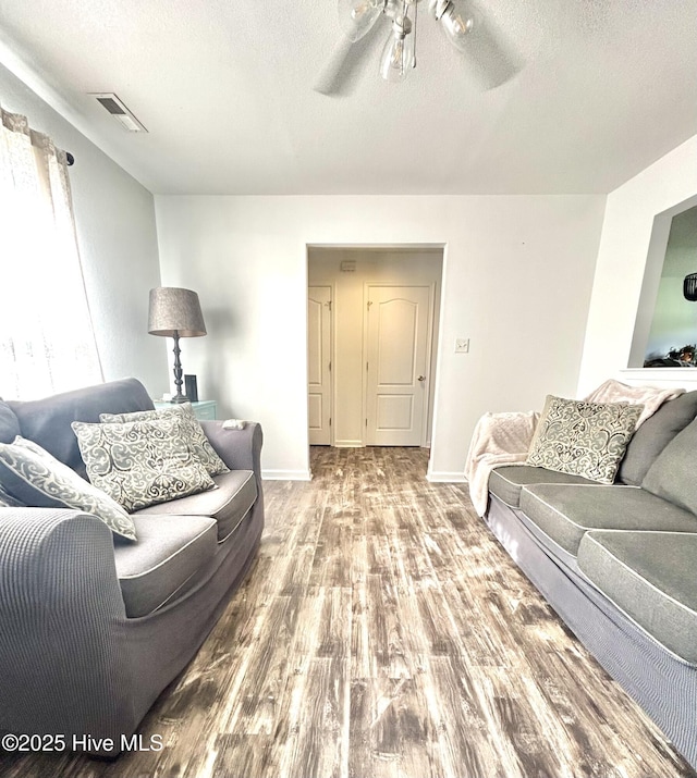 106 Cotton Ct, Camden, NC 27921 - living room featuring a textured ceiling, wood finished floors, and ceiling fan