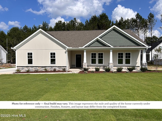 109 Lucky Ln, Pikeville, NC 27863 - view of front facade featuring a front yard, covered porch, and a shingled roof