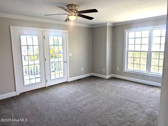 3 Sloop St, Swansboro, NC 28584 - spare room featuring dark colored carpet, a ceiling fan, and crown molding