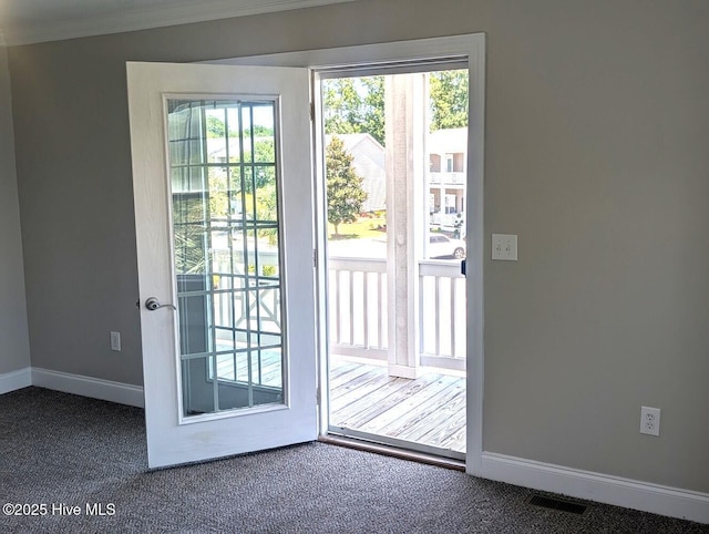 3 Sloop St, Swansboro, NC 28584 - doorway to outside with carpet flooring and crown molding