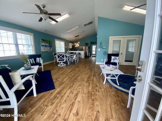 3 Sloop St, Swansboro, NC 28584 - living area featuring lofted ceiling, french doors, wood finished floors, and ceiling fan