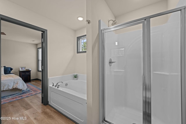 125 Trellis Ln, Vanceboro, NC 28586 - full bathroom with a shower stall, a garden tub, wood finished floors, and ensuite bath