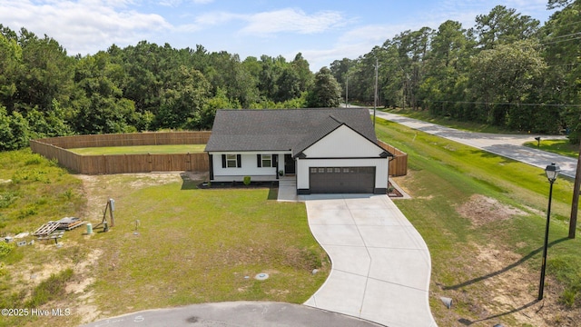 125 Trellis Ln, Vanceboro, NC 28586 - modern farmhouse featuring concrete driveway, a garage, and a forest view