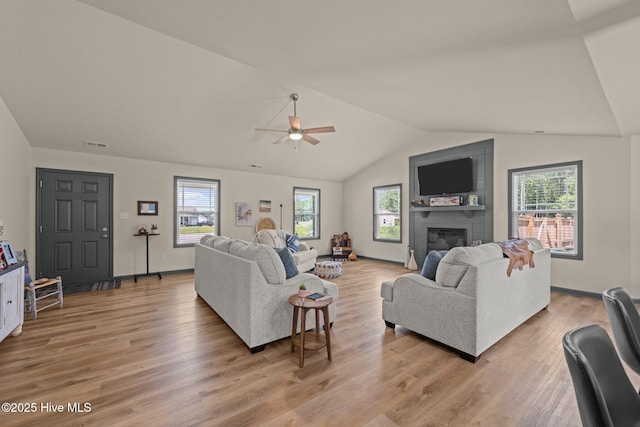 125 Trellis Ln, Vanceboro, NC 28586 - living room with a ceiling fan, plenty of natural light, light wood finished floors, lofted ceiling, and a fireplace
