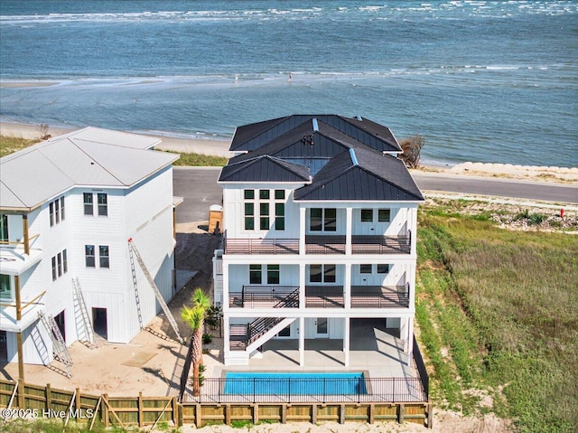 47 Grande View Dr, Ocean Isle Beach, NC 28469 - view of subject property featuring unending shoreline and a pool