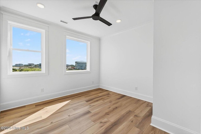 47 Grande View Dr, Ocean Isle Beach, NC 28469 - unfurnished room with healthy amount of natural light, ornamental molding, light wood-style flooring, ceiling fan, and recessed lighting