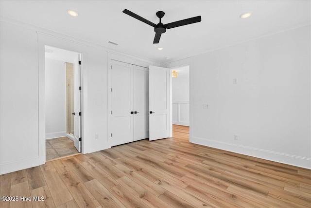 47 Grande View Dr, Ocean Isle Beach, NC 28469 - unfurnished bedroom featuring light wood-style flooring, recessed lighting, ensuite bathroom, a closet, and ceiling fan