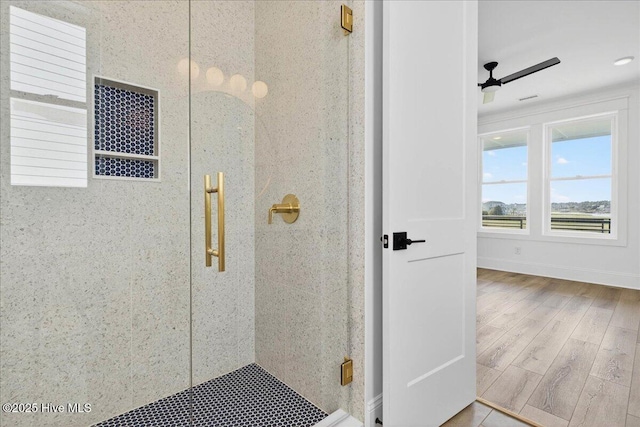 47 Grande View Dr, Ocean Isle Beach, NC 28469 - full bathroom featuring a stall shower, wood finished floors, and a ceiling fan