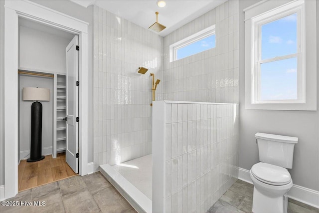 47 Grande View Dr, Ocean Isle Beach, NC 28469 - bathroom featuring a walk in shower and a spacious closet