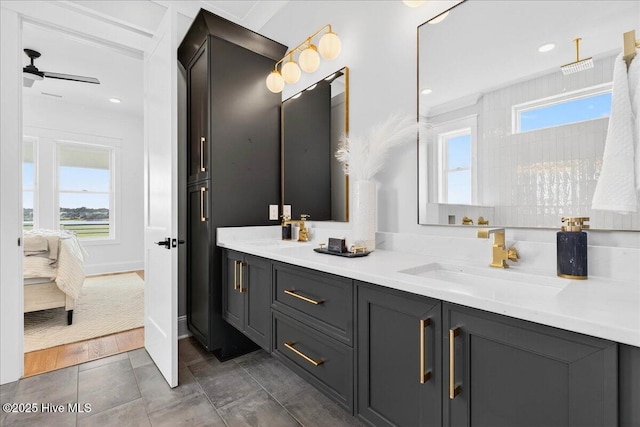47 Grande View Dr, Ocean Isle Beach, NC 28469 - full bathroom featuring double vanity, ensuite bath, and a ceiling fan