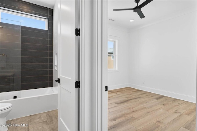47 Grande View Dr, Ocean Isle Beach, NC 28469 - bathroom featuring ceiling fan, wood finished floors, and bathing tub / shower combination