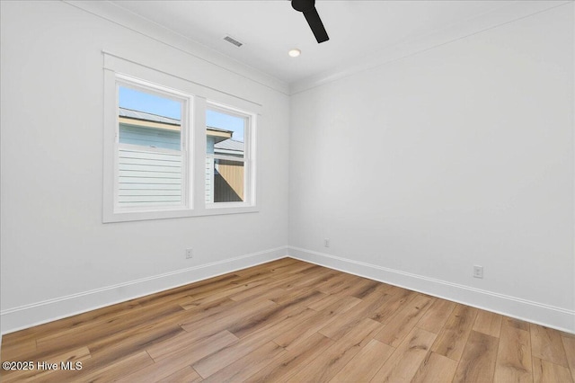 47 Grande View Dr, Ocean Isle Beach, NC 28469 - empty room with light wood-style floors and a ceiling fan