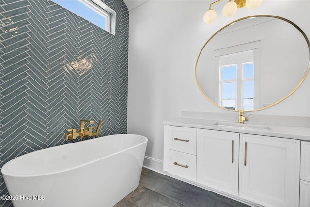 47 Grande View Dr, Ocean Isle Beach, NC 28469 - full bathroom featuring a freestanding tub, vanity, and tile walls