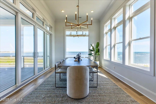 47 Grande View Dr, Ocean Isle Beach, NC 28469 - dining area with a chandelier, plenty of natural light, wood finished floors, and recessed lighting