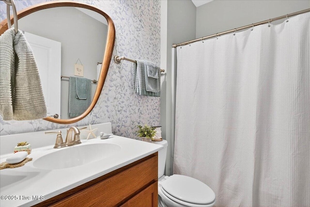 5198 Windlass Rd, Southport, NC 28461 - bathroom featuring wallpapered walls, vanity, and curtained shower