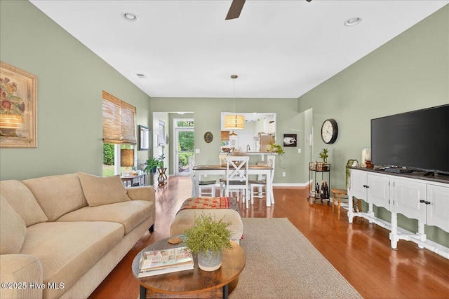 5198 Windlass Rd, Southport, NC 28461 - living area with wood finished floors, a ceiling fan, and recessed lighting